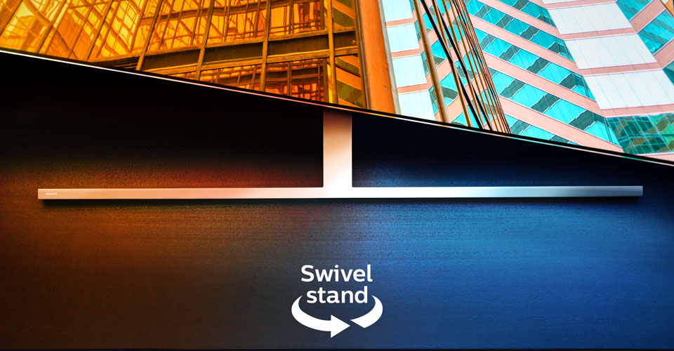 Телевізор Philips Ambilight на поворотній підставці відображає дві яскраві архітектурні сцени, зі стрілкою та текстом, що вказують на функцію повороту.